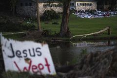 Texas searches for flood’s missing as more storms roll in
