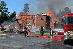 Members praise God in tents after fire destroys historic black church in South Carolina