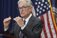 Stocks drop as the Fed keeps interest rates flat