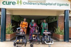 Christian ministries deliver the Gospel, over 200 wheelchairs to disabled Ugandan children