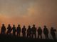 Thousands move, firefighters injured in California blazes