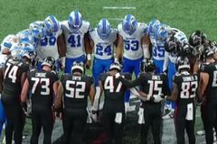 Lions, Falcons huddle in prayer as as ambulance takes injured Morice Norris off field