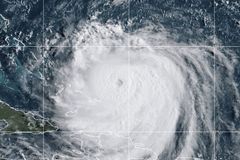 Category 4 Hurricane Erin churns off East Coast