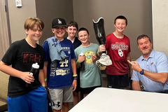 Fisher's prosthetic leg became a favorite sight at OKC Thunder games. For him, it's his faith coming full circle | Baptist Press
