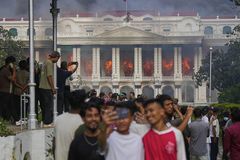 Nepal’s prime minister resigns as fiery protests continue