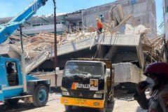 Dozens presumed dead after school collapses in Indonesia