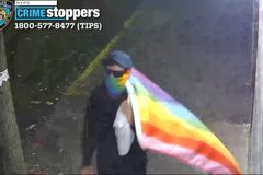 Masked suspect vandalizes 3 NYC churches with 'anti-Christian' messages while carrying LGBT flag
