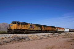 Railroad giants Norfolk Southern, Union Pacific vote to merge