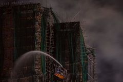 Death toll from Hong Kong apartment fires rises to 83; arrests made