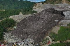 Dozens missing after Philippines garbage mound collapse, killing three