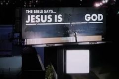 Man paints over heretical billboard to read 'Jesus is God' in viral video