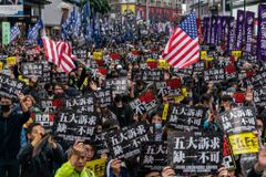 China issues arrest warrants for 6 Hong Kong pro-democracy activists, including US citizen