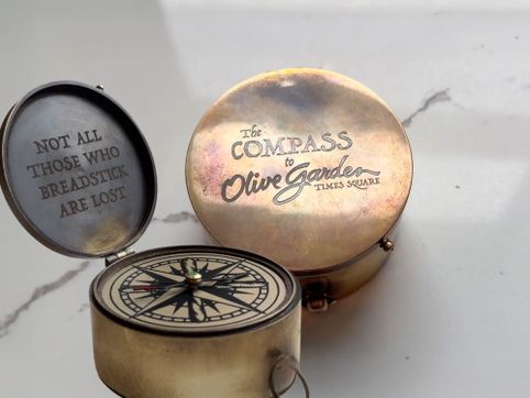 Two Guys Made a Compass That Always Points to the Times Square Olive Garden - RELEVANT