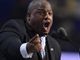 Televangelist Mark Burns defends golden Trump statue