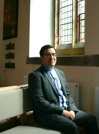 Priest wins settlement overturning blacklisting for comments on LGBT+ ideology