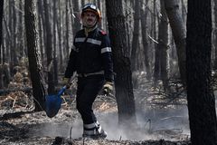 European wildfires rage on; Some French evacuee allowed home