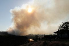 Arson suspected in huge Washington wildfires; Man arrested