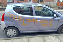 Man removes “Jesus Loves You” sticker after insurance threats
