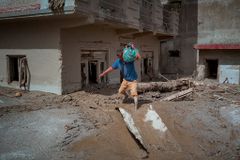 Nepali churches reach cut-off valleys by mountain bike as Himalayan floods leave hundreds dead