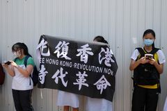 Hong Kong bans protest anthem in schools as fears over freedoms intensify