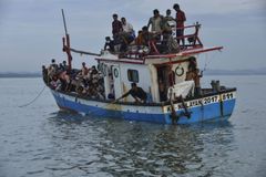 Rohingya refugees get emergency treatment after boat lands in Indonesia