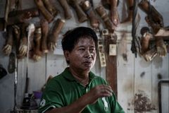 Indonesian leprosy survivor crafts new limbs for shunned villagers