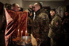 Ukrainian troops seek solace in faith and prayer