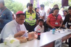 New bishop Dael dines with poor after ordination