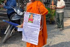 Defrocked Cambodian monk flees to Thailand, resumes religious life there