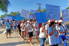 Fisherfolk march to stop black sand mining in Aparri