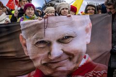 Demonstrators in Poland defend late pope John Paul II