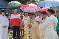 Cebu Caritas turns over transitional shelters to 65 families
