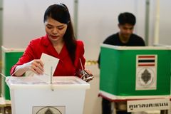 Thais queue at temples, schools as early voting begins