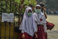 Hundreds of schools shut as forest-fire haze blankets SE Asia