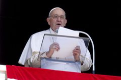 Pope Francis praying and working from hospital