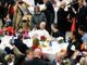 Pope Francis shares meal with the poor