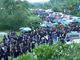 Sea of black as thousands flock to slain priest’s funeral