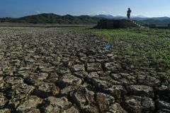 Philippine settlement submerged by dam reappears due to drought