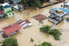 Philippines cleans up as typhoon death toll rises