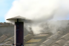 White smoke puffs out of Sistine Chapel chimney, signaling election of new pope