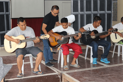 Inmates rediscover joy, faith through guitar lessons