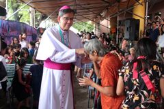 Cebu archbishop plants trees, shares meal with poor ahead of installation
