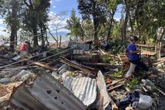 Philippines digs out from Typhoon Fung-wong as death toll climbs to 18