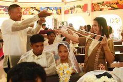 22 couples tie the knot amid bombings