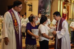 IN PHOTOS: Families receive ashes of victims of Philippine government’s war on drugs campaign as memorial wall is unveiled